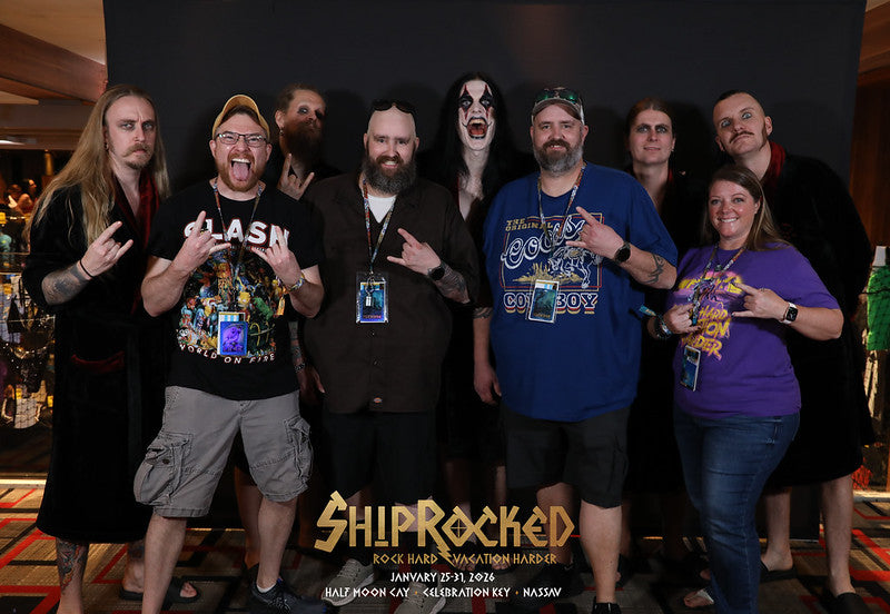 Fans posing together with band members using 'ShipRocked' branding for photo op