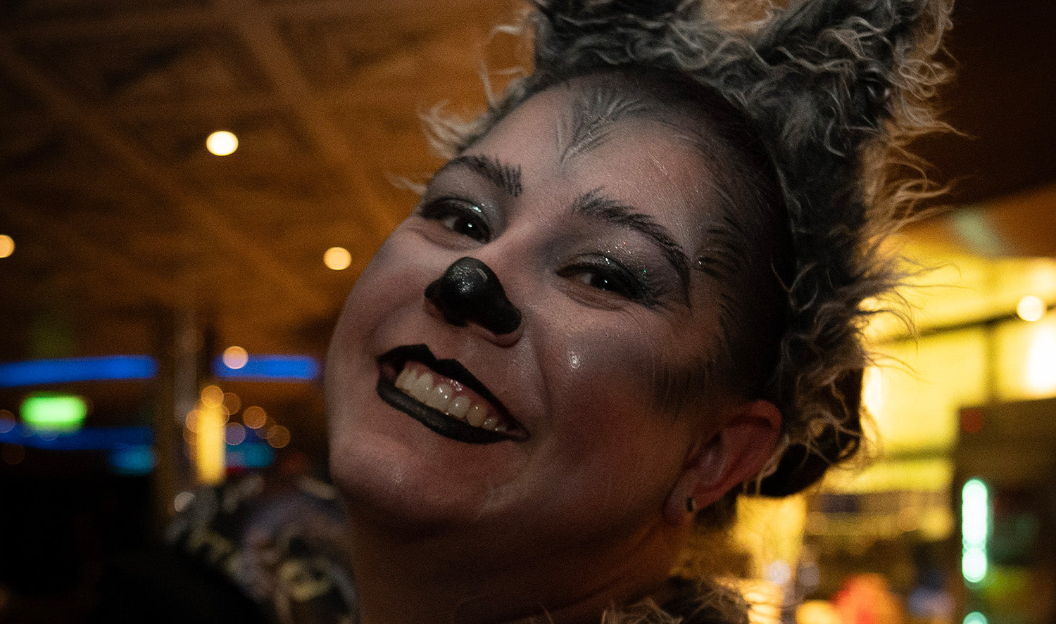 Smiling woman with dog makeup